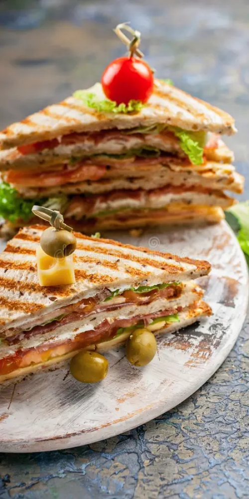 closeup-smoked-beef-sandwich-green-salad-round-cutting-board-traditional-breakfast-lunch-vertical-shot-146549826.jpg
